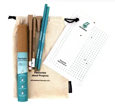 A plantable pen and pencil kit with a seed card and a cotton pouch