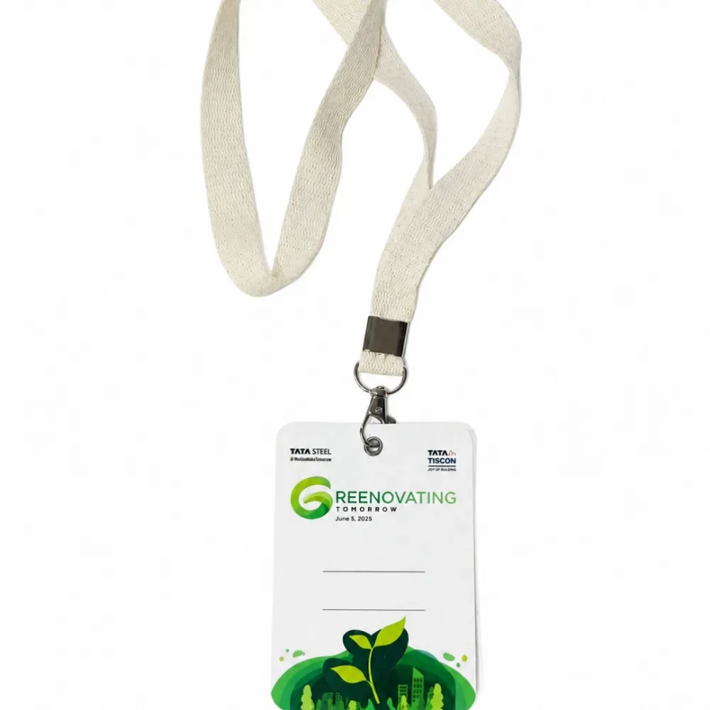 Printed seed-paper event card attached to a fabric lanyard and metal clip